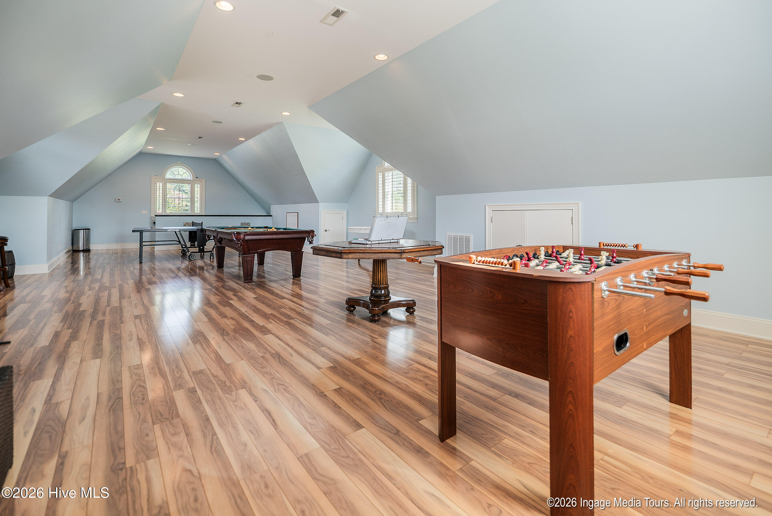 Rec room over detached garage is large enough for foosball, poker, pool and ping pong tables!