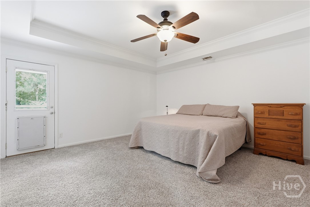 Primary Bedroom features a door to the back deck t