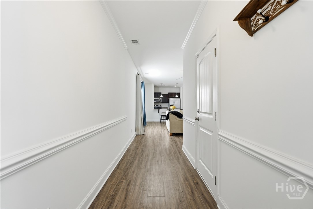 Foyer is spacious and offers a view of the open-concept living.