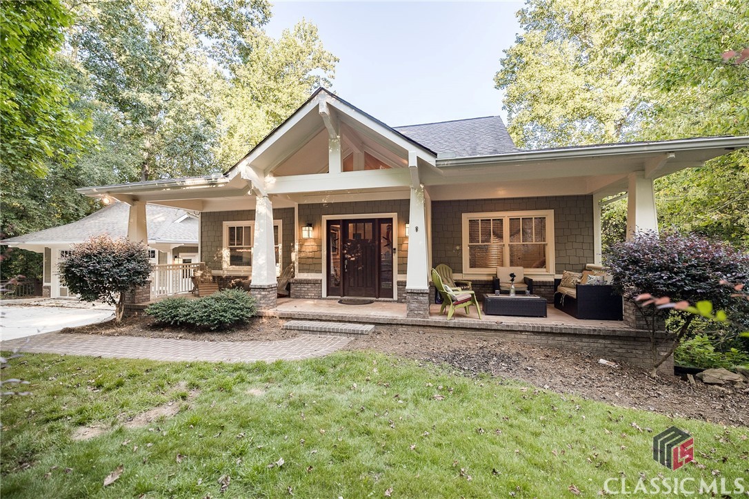 Welcome to 435 Fortson, a lovely sprawling craftsman style bungalow in the heart of Five Points on a large lot. This incredible 4 bedroom, 3.5 bath was custom built by a builder as his personal home, so no detail has been left out, and everything is top notch. There is a welcoming rocking chair front porch that leads you into the foyer with its vaulted ceilings, large picture windows, and gleaming hardwood floors. You’ll find three bedrooms on the main floor. The primary bedroom is spacious and features a sitting area with an amazing birds-eye view of the huge backyard, 2 walk in closets, and a large spa-like bathroom complete with a jacuzzi tub, double vanity, and separate shower. The other two bedrooms on the main floor are bright, welcoming, and generous in size. The staircase is wide and grand and makes a statement in and of itself! The living area features an open floor plan- a perfect place for the family to enjoy being together as well as an incredible space for entertaining. The kitchen is complete with stainless steel appliances, granite counter tops, custom cabinetry, slate backsplash, recessed lighting, and an enormous walk-in pantry. The kitchen is open to the breakfast room and den, which seamlessly connect to the dining room. This entire space is surrounded by a wall of windows at the back of the house, which leads to the wonderful back deck overlooking the large backyard and lovely creek. Off of the den, there is a hallway with a wall of custom mudroom cabinetry. Through the hallway there is a large bedroom suite with its own private entrance that could be used as an in-law suite or a great place for visitors to stay and have complete privacy.  The finished basement has plenty of space for a second den, game room, or a playroom. The huge backyard has a beautiful creek as a backdrop. This property is complete with a two car garage. This home has everything to fulfill your needs and wishes, all with a location and value that cannot be beat! Come see 435 Fortson today!