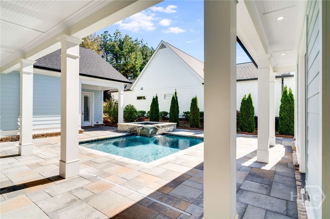 Outdoor living space with pool and spa