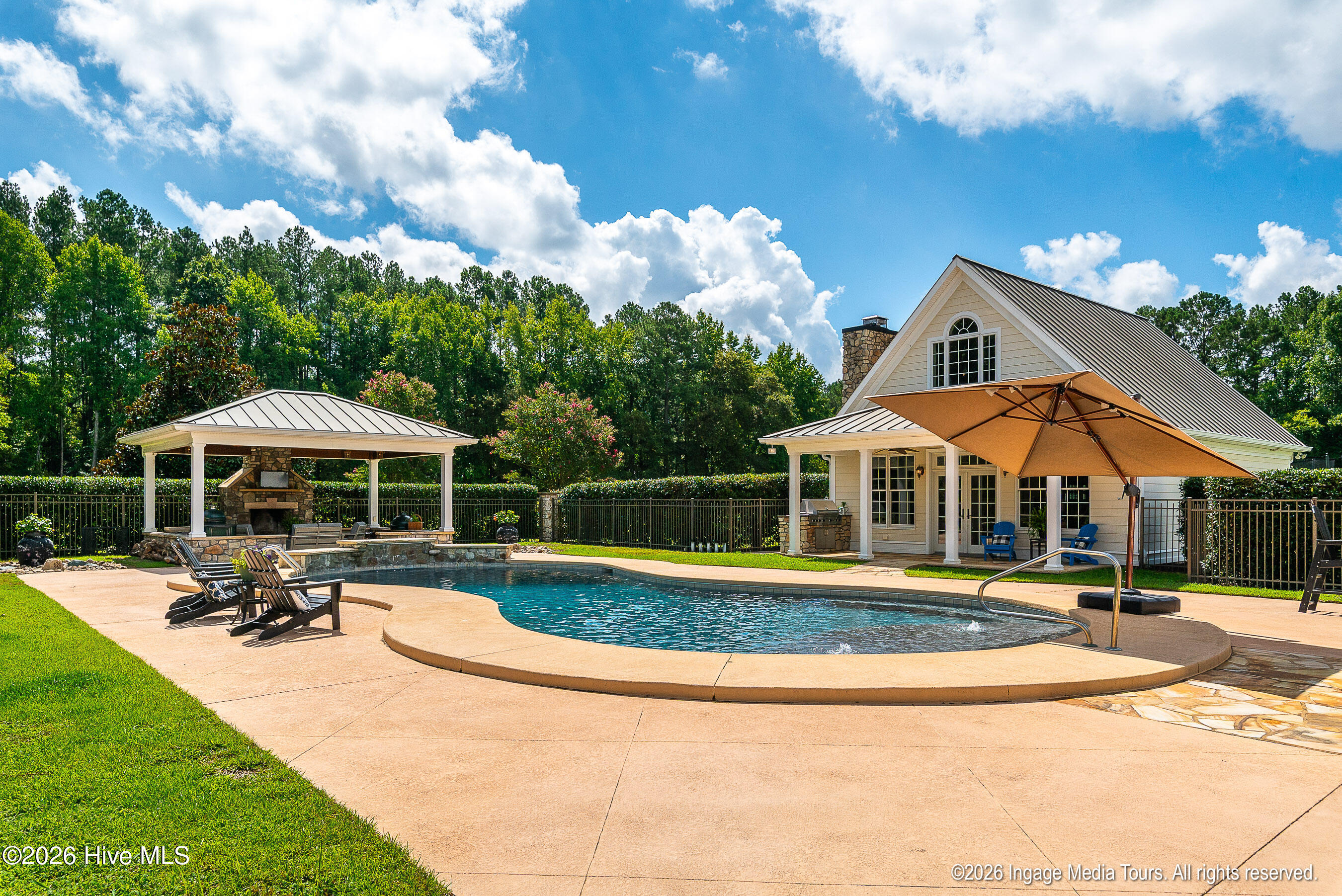 View of Guest house, pool and pavilion.