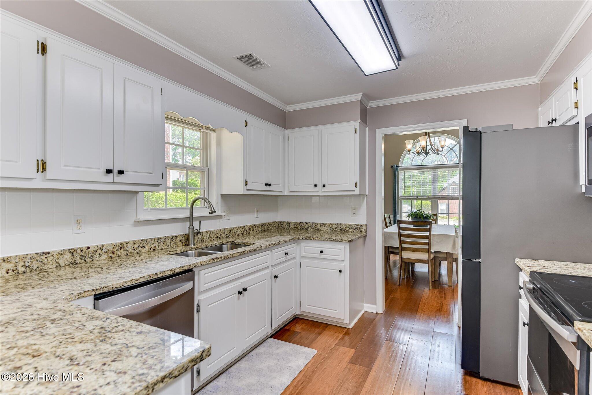 Neutral Granite and White Cabinets to go with any decor!