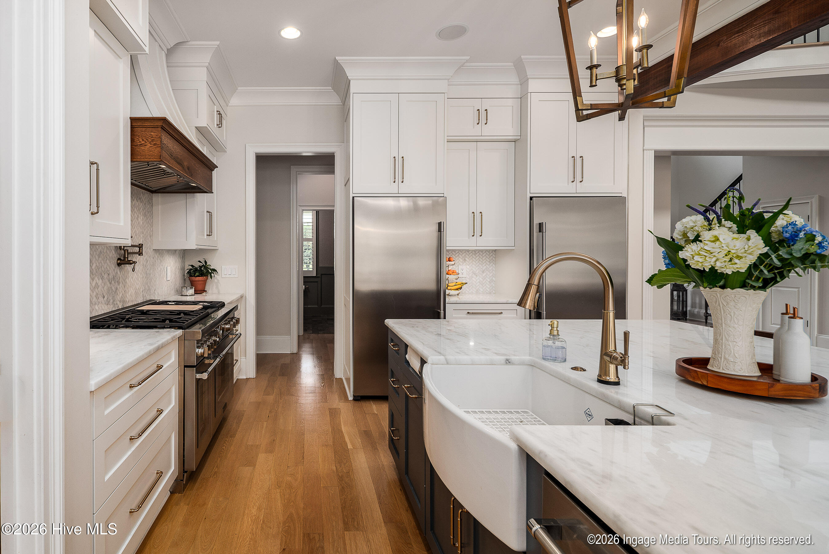 Some of this kitchen's features include Farmhouse sink, Thermador gas range, freezer and fridge