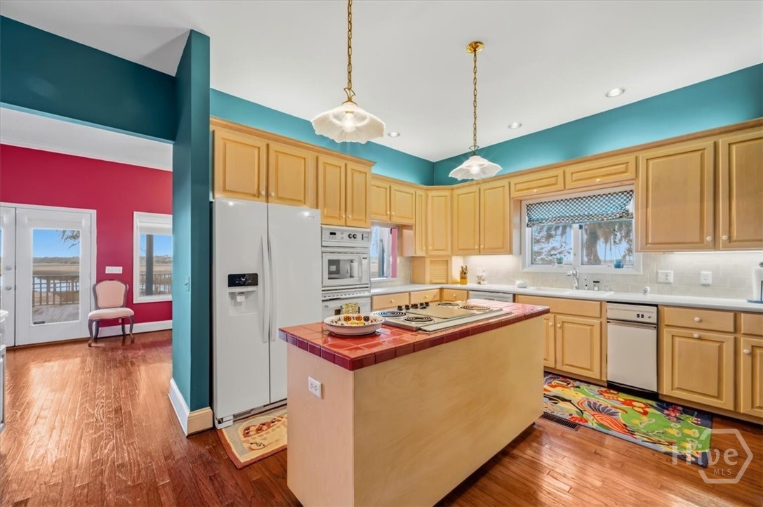 Kitchen view and walkway open to Dining Area
