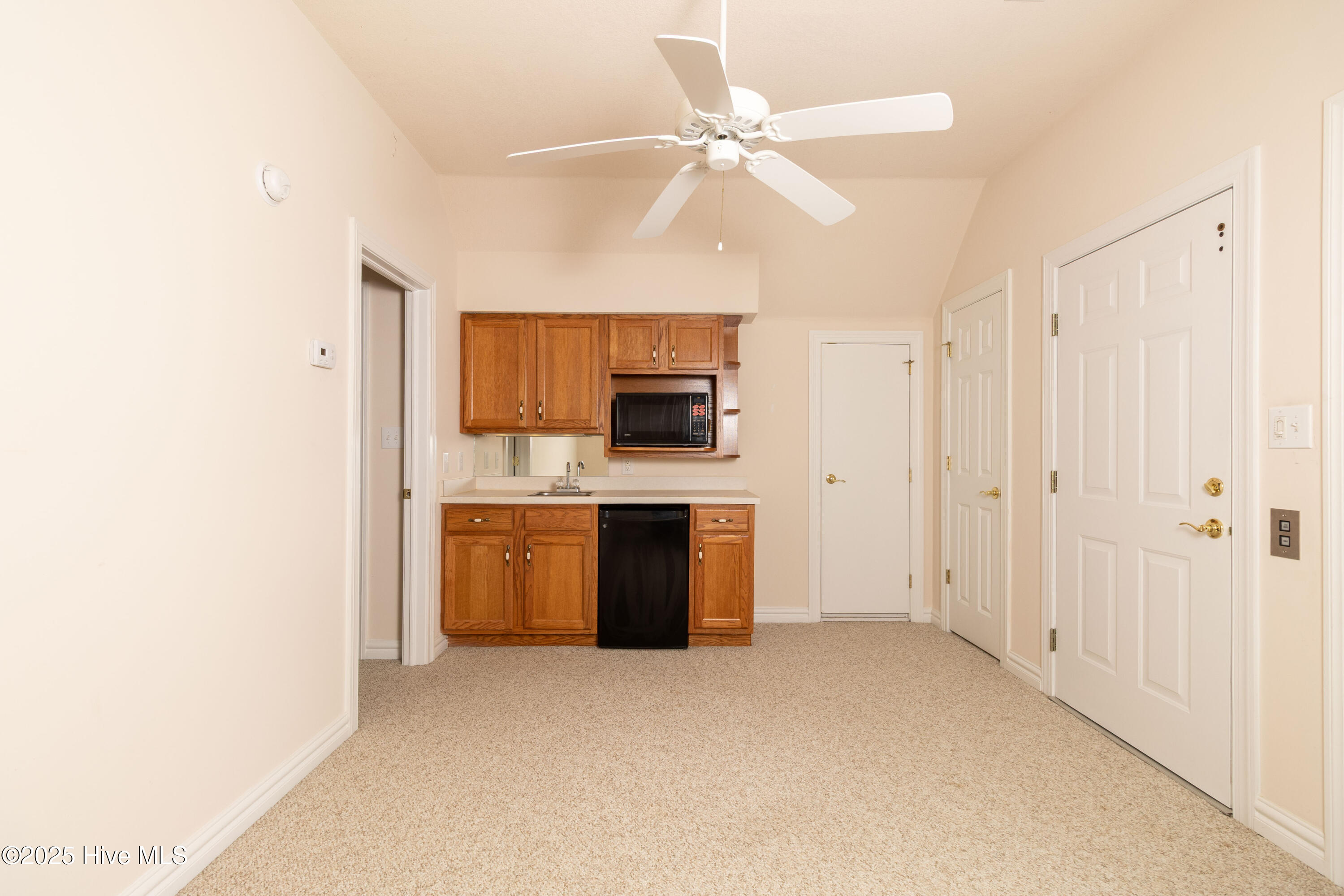 Private suite living area over garage