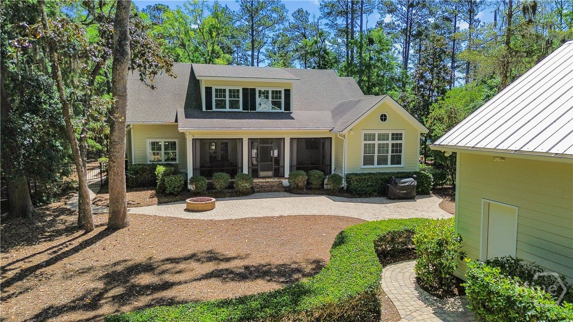 Back of the home and detached garage