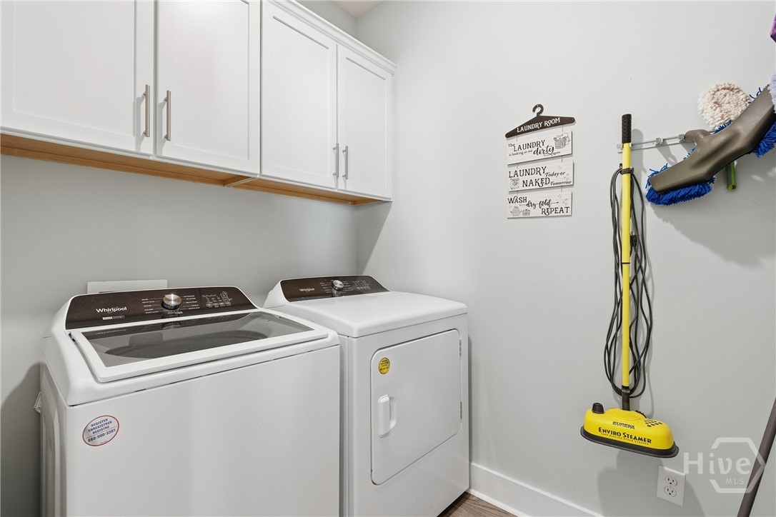 Laundry room with washer and dryer that remain with the home