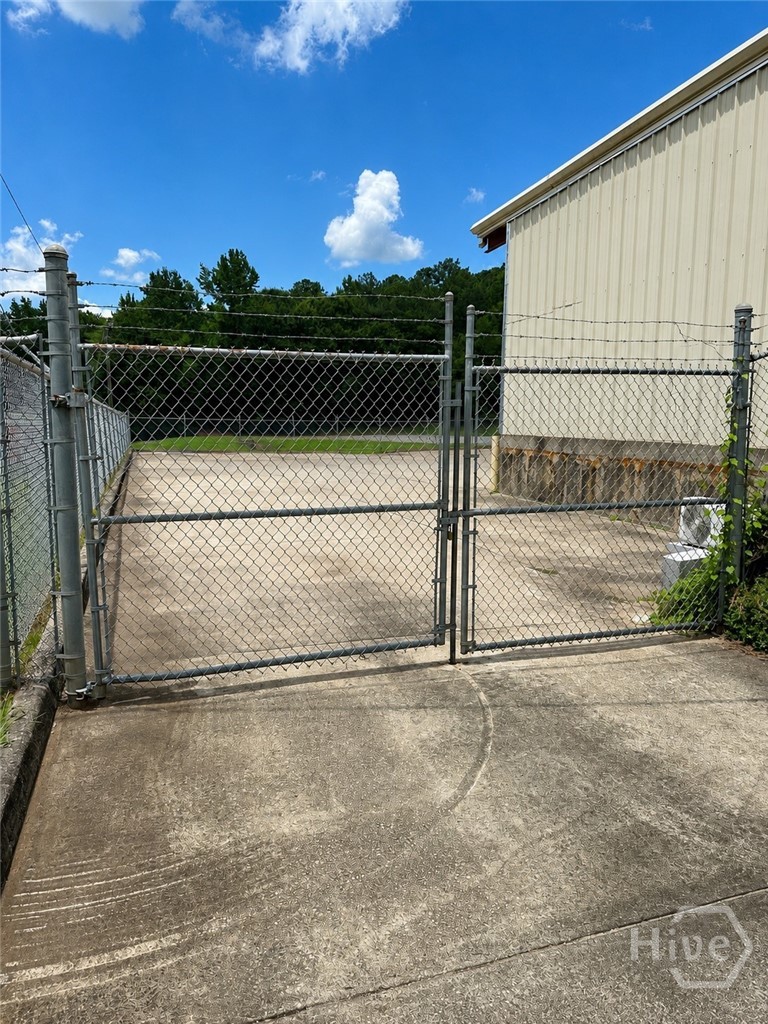 13-foot wide locking chain-link gate, 255 Collins