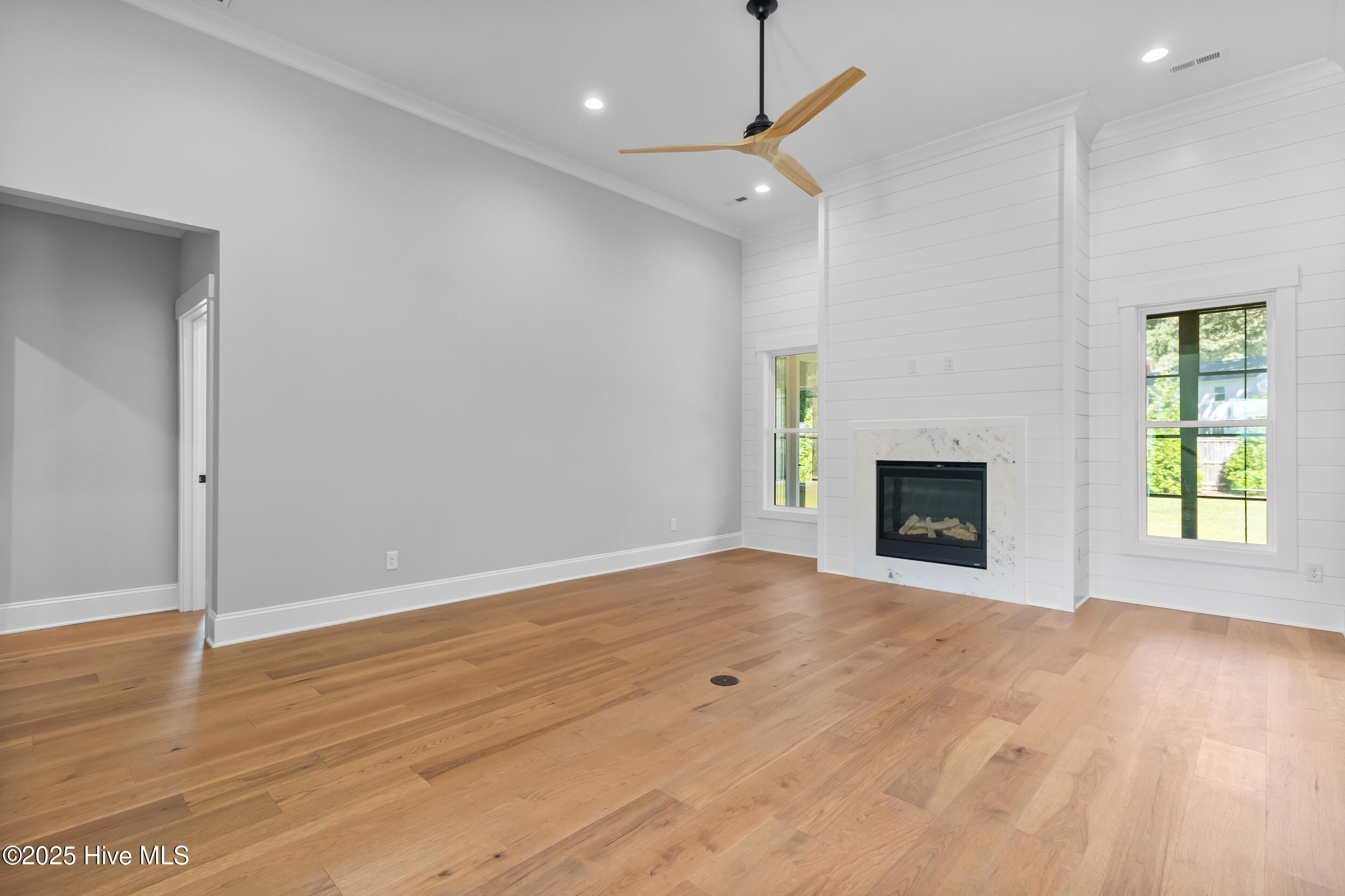 Living room with fire place and high ceilings
