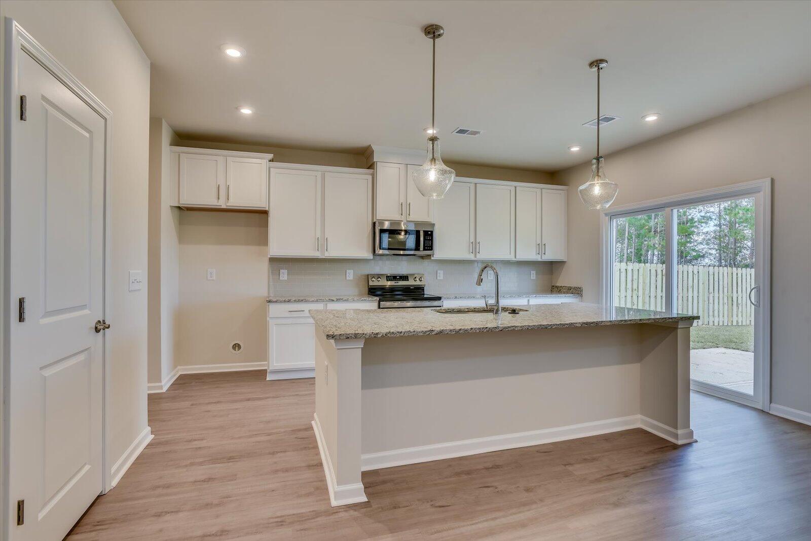 Kitchen w/ Access to Covered Patio