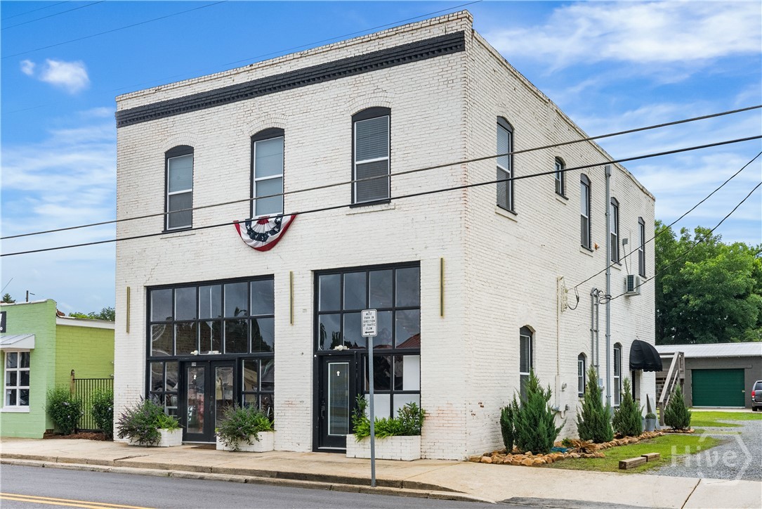 Retail on Bottom, Two Rental Units on Top Floor