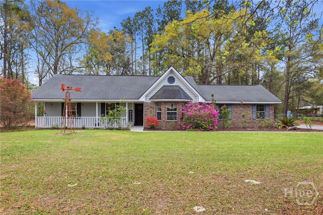 Motivated Sellers! All-brick ranch on a full acre with NO HOA + amazing 24×36 WORKSHOP! Back on market at no fault of the seller! Discover the perfect blend of rustic charm, privacy, and peaceful Rincon living. This inviting 3-bed, 2-bath home offers easy single-level living, starting with a vaulted living room featuring wood-laminate floors and a bold wood-burning fireplace. Remarkably spacious kitchen boasts a vaulted ceiling, abundant cabinet space, pantry, island with extra storage, wine chiller, and a bright breakfast area that accommodates a large table in front of the bay window where unlimited pancakes can be served all day long! A separate room off the kitchen provides an oversized pantry and laundry. The main bedroom features a tray ceiling, while the updated main bathroom offers a tiled walk-in shower and a spacious closet. Served by a private well with water purifier and septic system, the home also includes a side-entry two-car garage with cabinets and shelving. Outside, enjoy a massive 24×36 WORKSHOP that provides the ultimate escape for projects, storage, or hobbies. Screened porch is ideal for hosting gatherings or simply relaxing, and do not forget the Hot Tub! The private, fully fenced backyard features mature oak and pine trees and backs up to peaceful woods, creating a serene retreat with room to roam. A full RV hookup and shed add flexibility. Tucked away yet close to shopping, restaurants, I-95, I-16, Gulfstream, and the Ports, this property delivers space, privacy, and personality—the perfect place to feel at home.