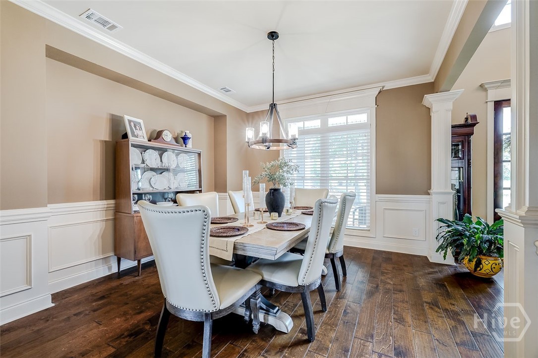 Beautiful wood floors throughout the main living, detailed crown molding and chair rail detailing, inset wall for hutch or buffet table
