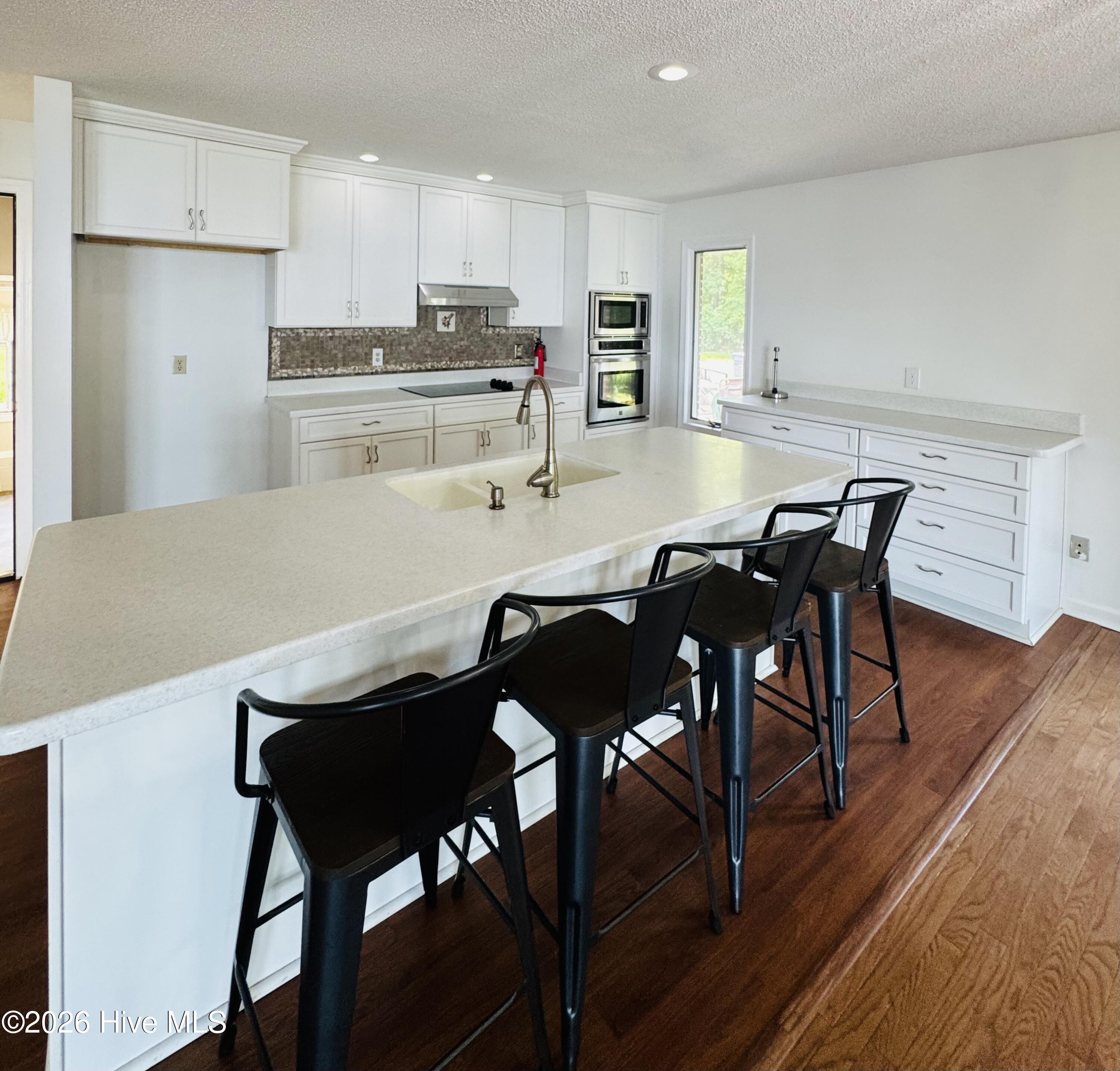 Large Island, hard surface counter tops.