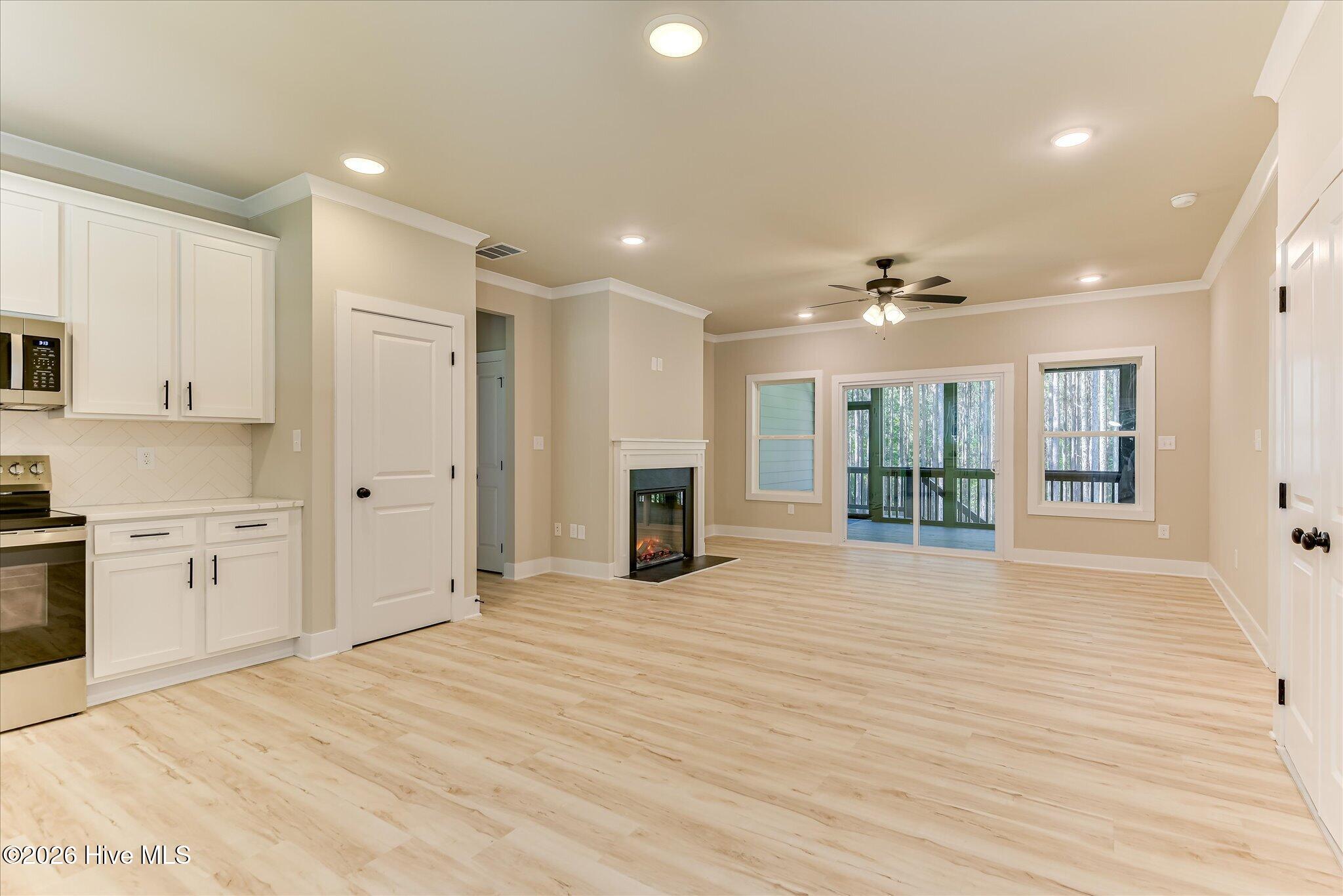 Open, split floor plan, kitchen/living/dining, an abundance of natural light