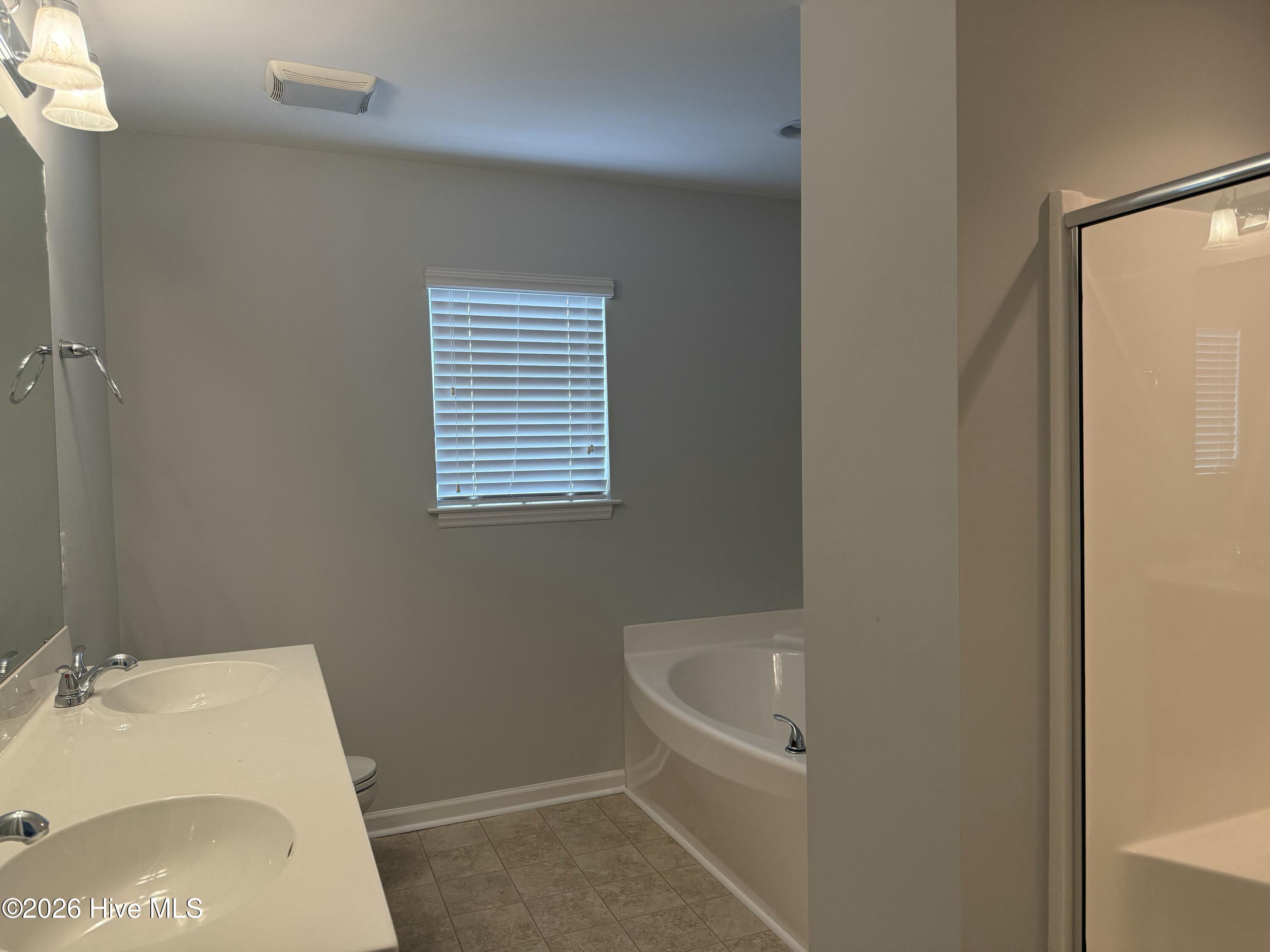 Master bath with tub and shower