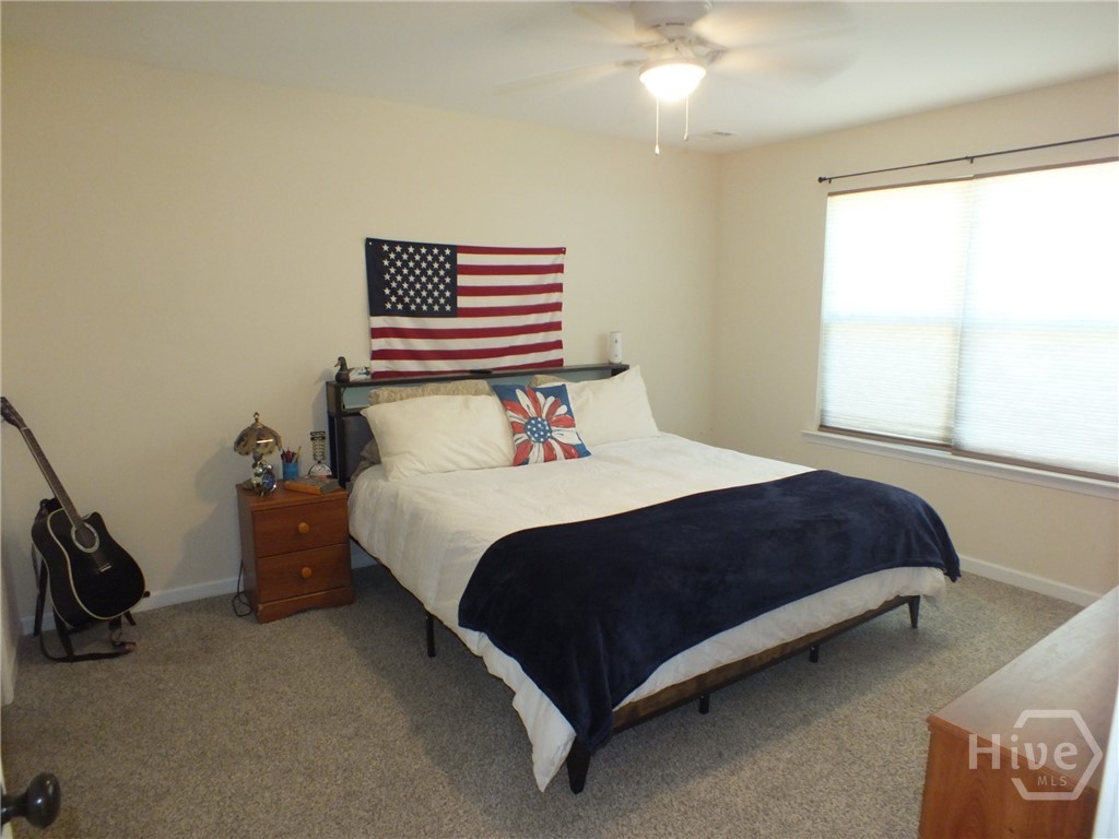 Large Owners Suite. This is a king sized bed! Bathroom boasts soaking tub, shower combination. A Huge walk in closet, and double vanity.