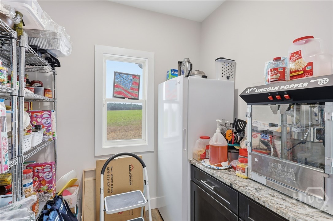 Large butler's pantry off kitchen for fridge & coffee bar & pantry