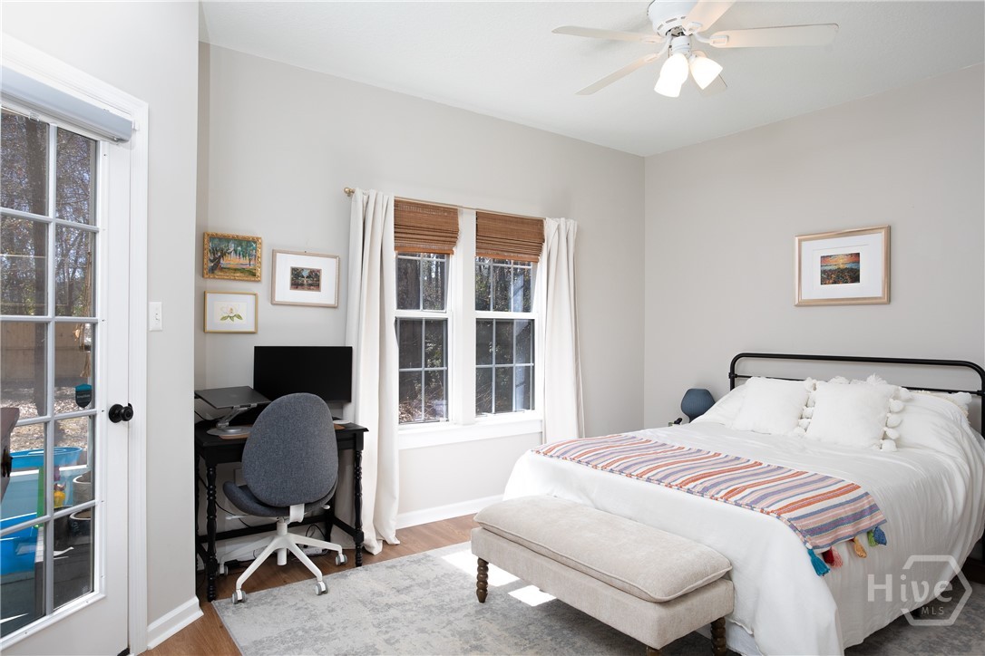 Bedroom downstairs w/ screened porch access