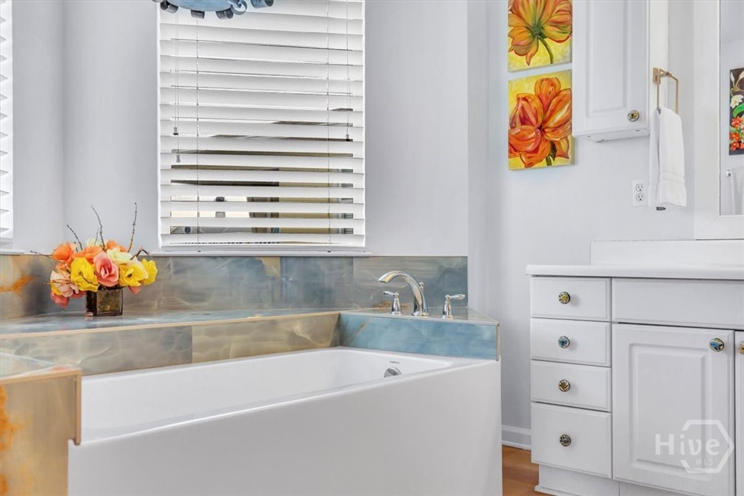 Top floor primary bathroom with soaking tub