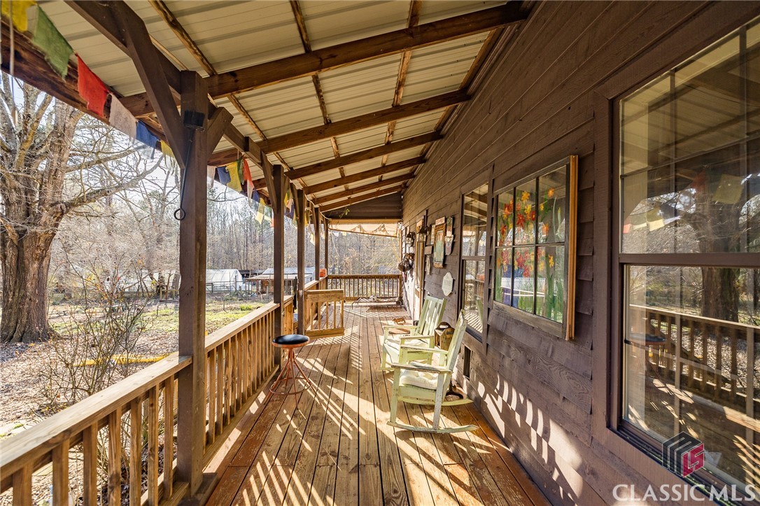 This beautiful 1900s historic home has a unique history and is situated on a beautiful 10 acre lot with a pond, outbuildings and a horse barn. The interior features a rustic wood stove, wide plank antique pine floors, ship lap walls and bead board ceiling, giving it a cozy, traditional feel. The open country kitchen is a great feature and the main level has a recently renovated full bathroom, adding a touch of modern. With two additional bedrooms, one with a private full bathroom, and an attic room that could be used as an office or bedroom, this home an abundance of space. Plus, the new HVAC upstairs will keep everyone comfortable year-round. This stunning property is a must-see! The exterior of the home features a covered front and back porch, a brand new in-ground pool, two yurts, a greenhouse and storage with building supplies, there is something for everyone to enjoy. Plus, the guest house, partially restored, will make a great addition to the property. Don’t miss this incredible opportunity!It really is an idyllic property and perfect for anyone looking for a unique, historic home with plenty of outdoor space for horses or livestock.