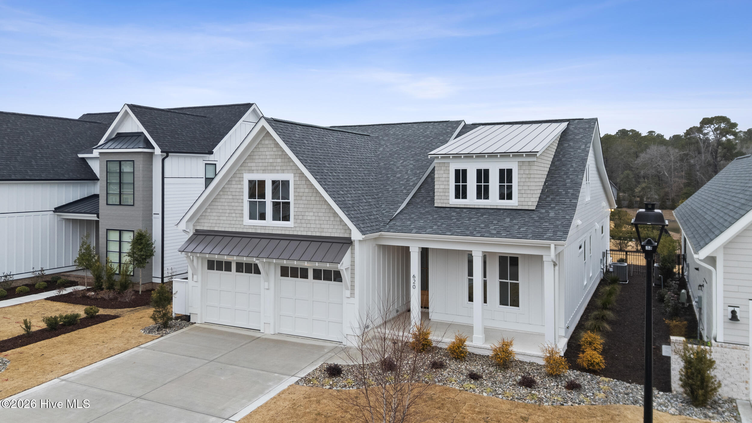 Side view of home, 2 car garage, street parking