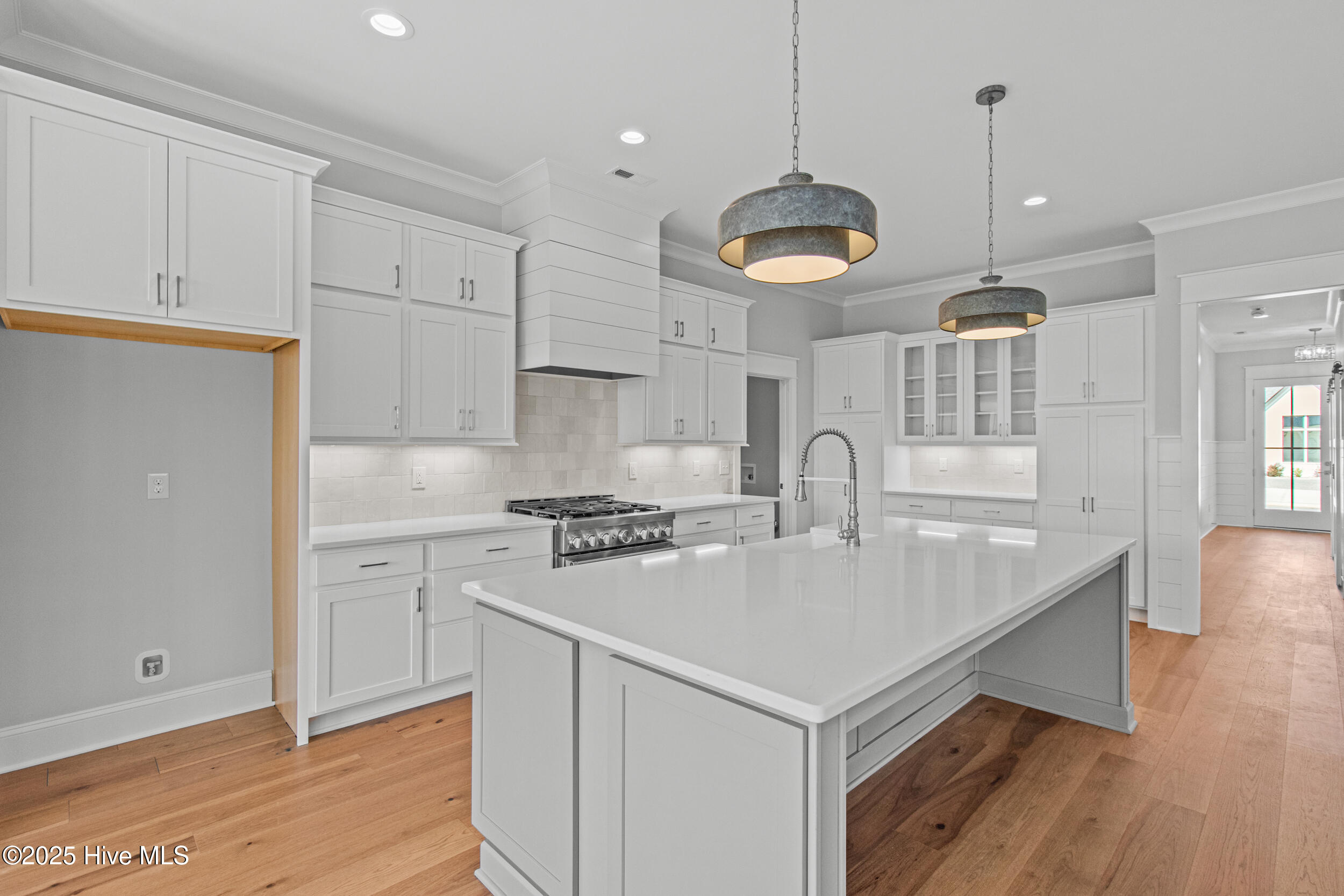 Kitchen with new appliances, island, and seating