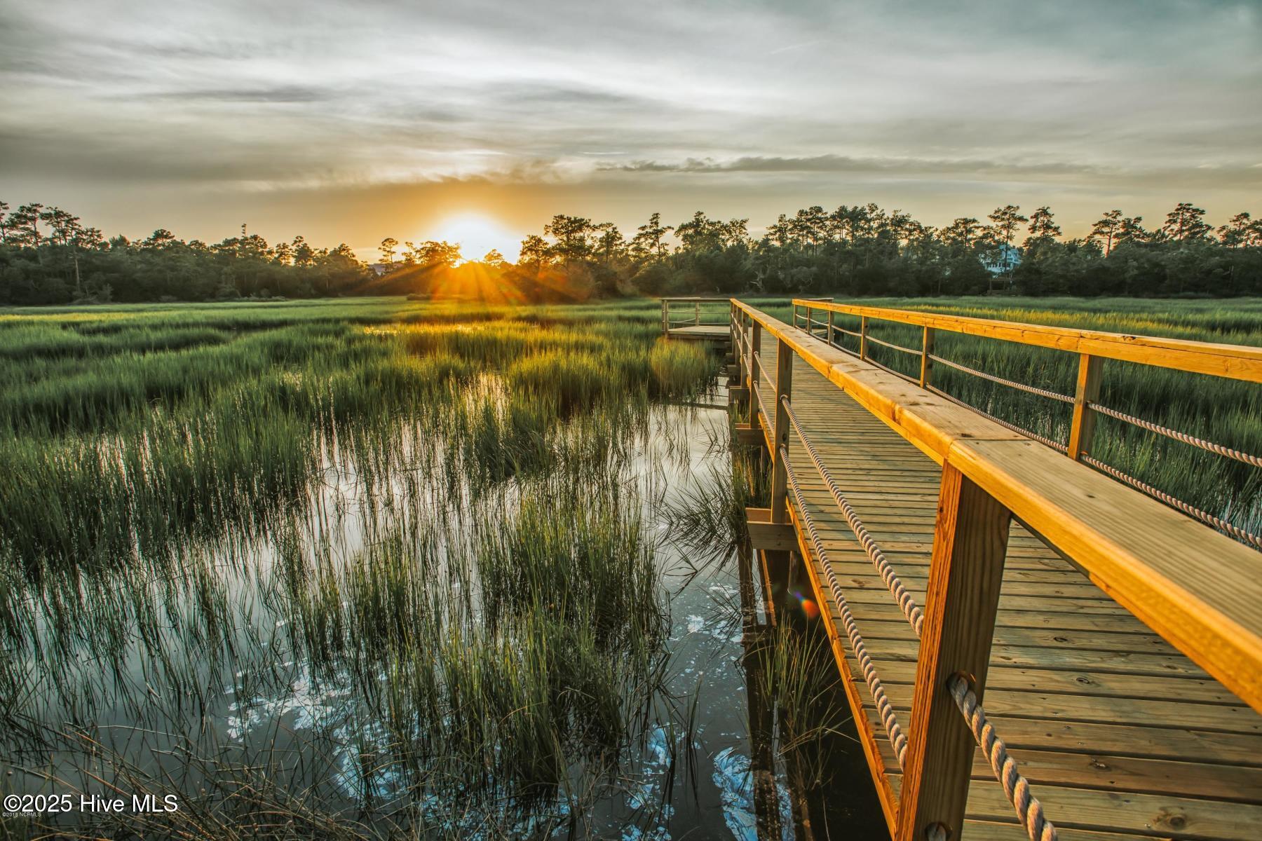 Community dock with sunset over Pages Creek