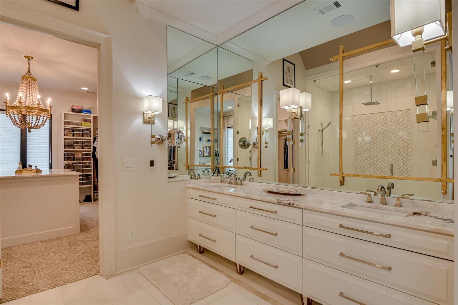 Master Bathroom- Marble floors and shower Quartzite countertop. Built-in mirrored medicine cabinets. Nickel faucets and hardware Barrel ceiling. Free standing tub. Toilet room with Kohler Bidet toilet seat. Large glass enclosed shower; two shower heads and a center rain shower head.