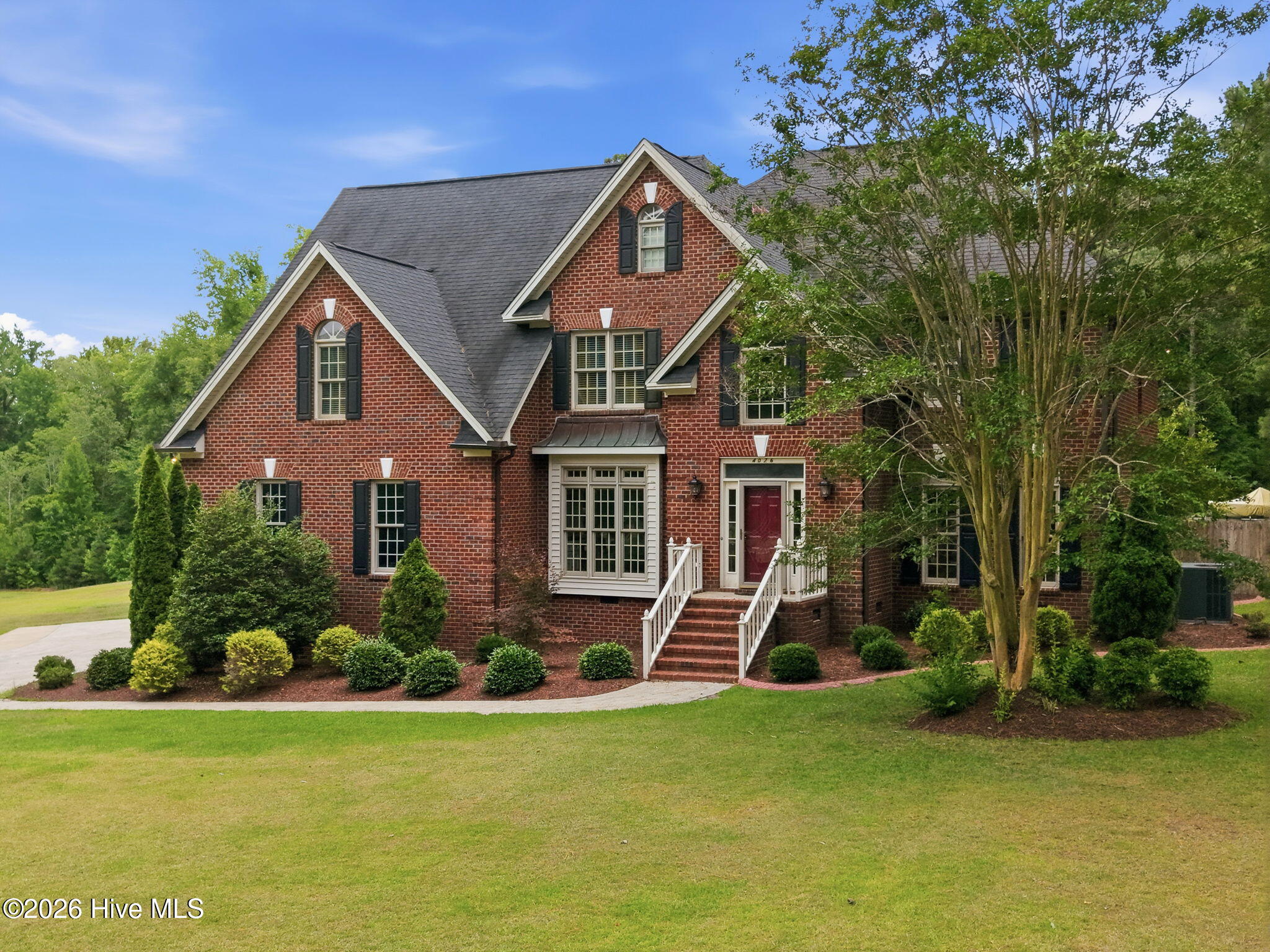 front beautiful manicured lawn and landscaping