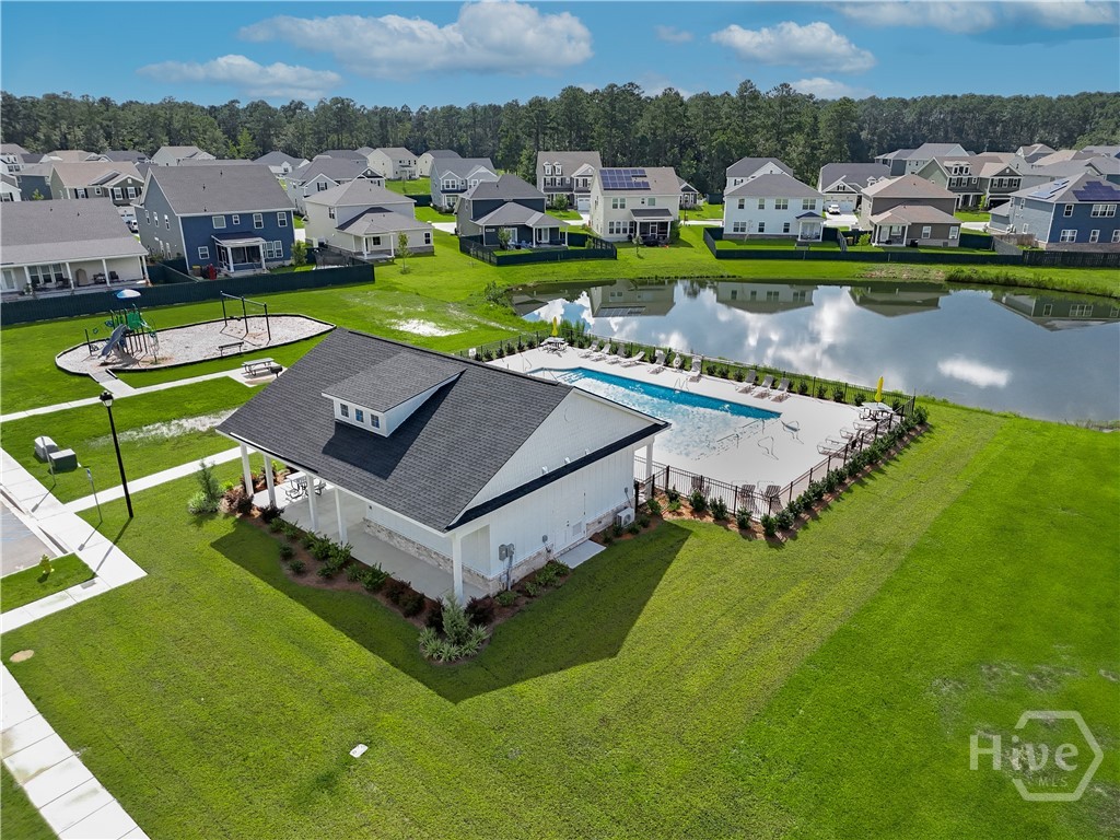 Community amenity center features a pool, cabana and playground.