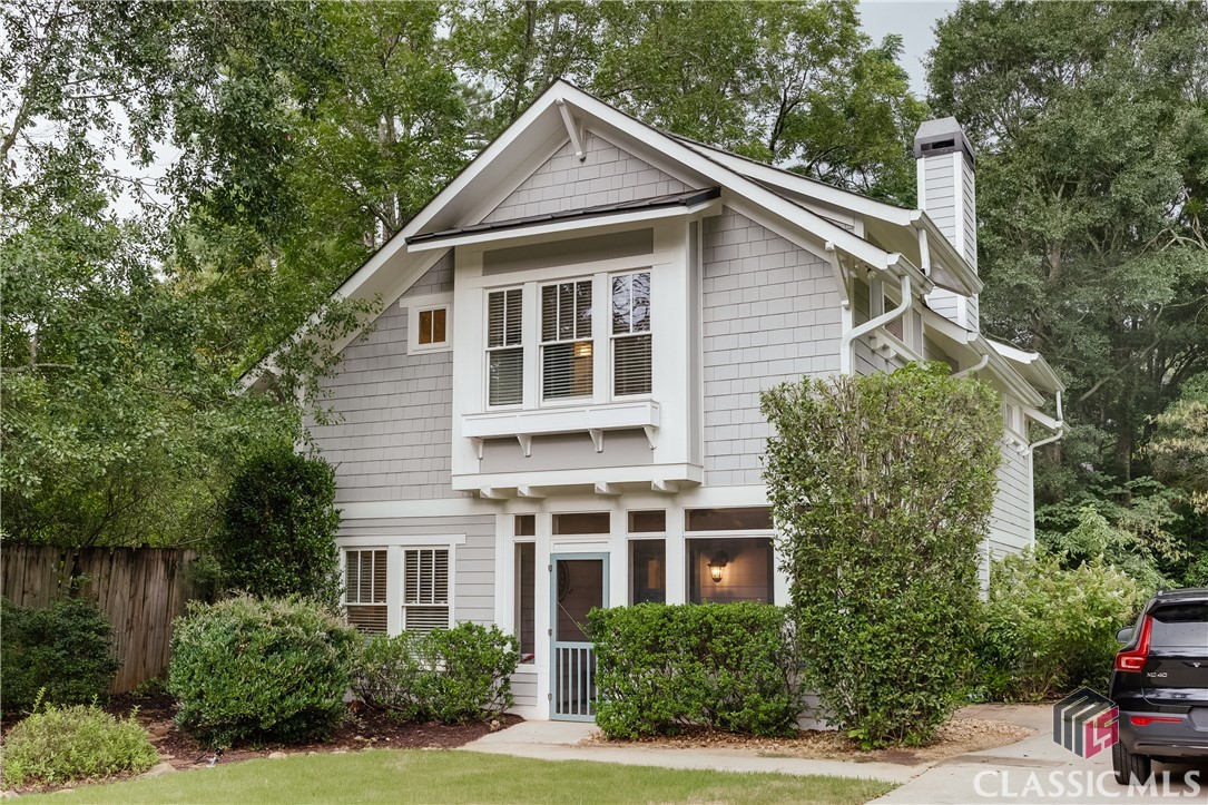 Welcome to this charming two-story Craftsman-style home in the wonderful Five Points location. Featuring 4 bedrooms and 3 bathrooms, this home offers unparalleled convenience.The charming front door is accessed through a cozy screen porch, and opens into a great room with a wood burning fireplace and built-in shelving. This space flows into the kitchen and dining area via a large encasement, and allows for an open concept feel.The gorgeous kitchen boasts a large island with bar seating and high ceilings, making it a delightful space for cooking and entertaining. A dedicated dining space is large enough to be used as a keeping room if so desired. Enjoy the spacious, covered patio for outdoor relaxation and gatherings with access from the kitchen. This recently built outdoor oasis provides a spacious covered area, as well as a large open space for a fire pit and seating. The owner's suite and two additional bedrooms are located on the upper level, along with a large laundry room with utility sink. The owner's suite bathroom features a soaking tub and large tile shower. A main level bedroom offers a flexible space perfect for private guest quarters or a quiet home office.A short walk lands you in the heart of Five Points, where you can enjoy a variety of shopping and dining options. Plus, this home is zoned for the award-winning Barrow Elementary School, ensuring excellent education opportunities. Welcome home to 128 Old Princeton Road.