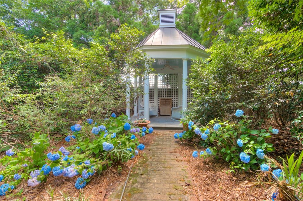 Gazebo surrounded by gardens