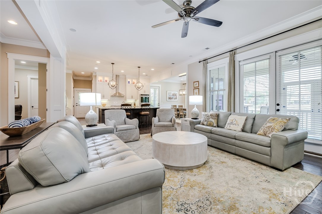 Open living room with doors to screened porch