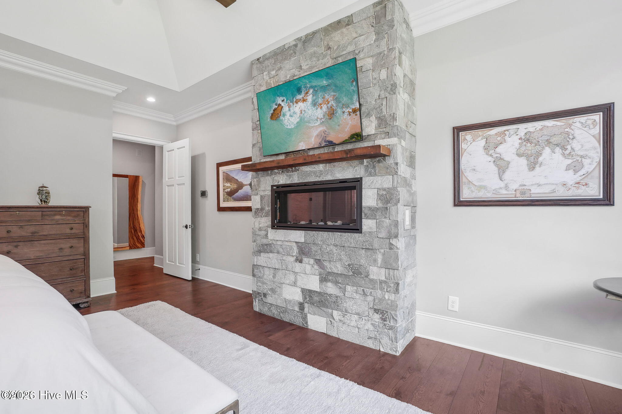 Master bedroom with huge picture windows vaulted ceiling with oversized rustic beams and contemporar