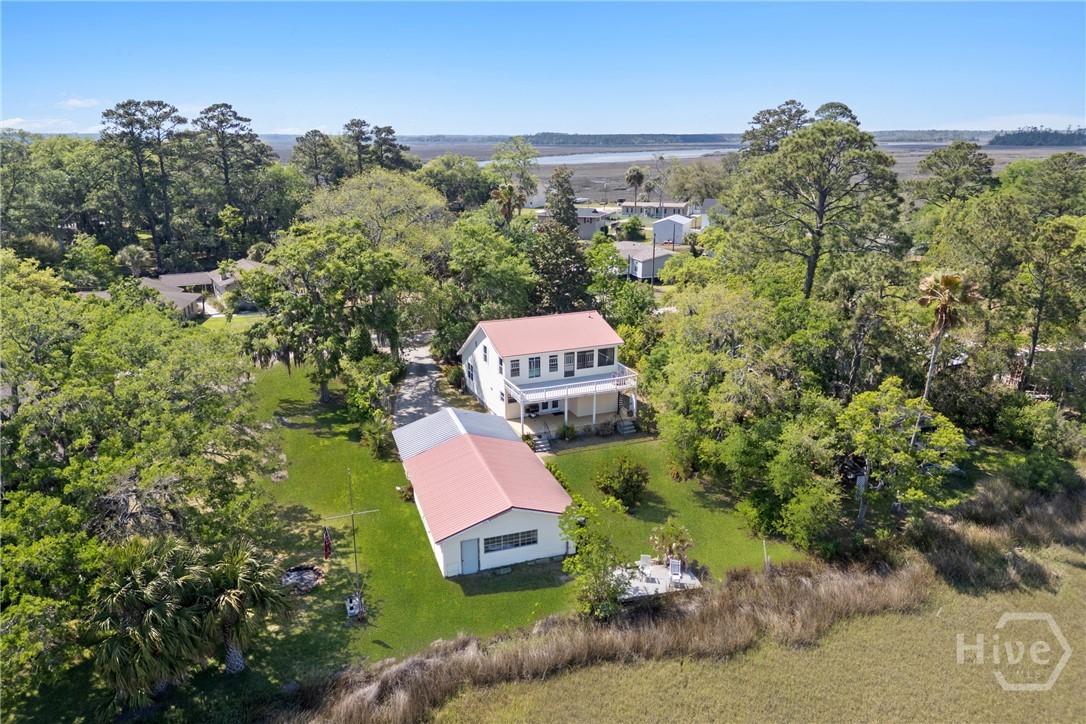 Aerial view of the property showcasing the home, d