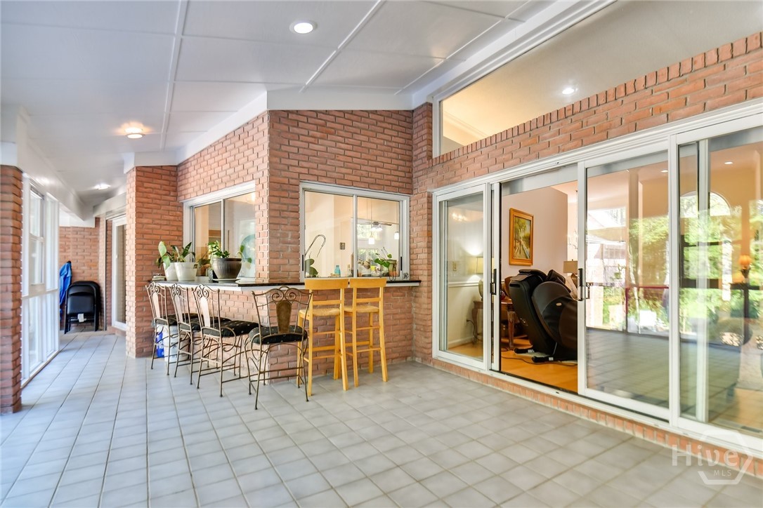 The enclosed patio off the Living room and kitchen