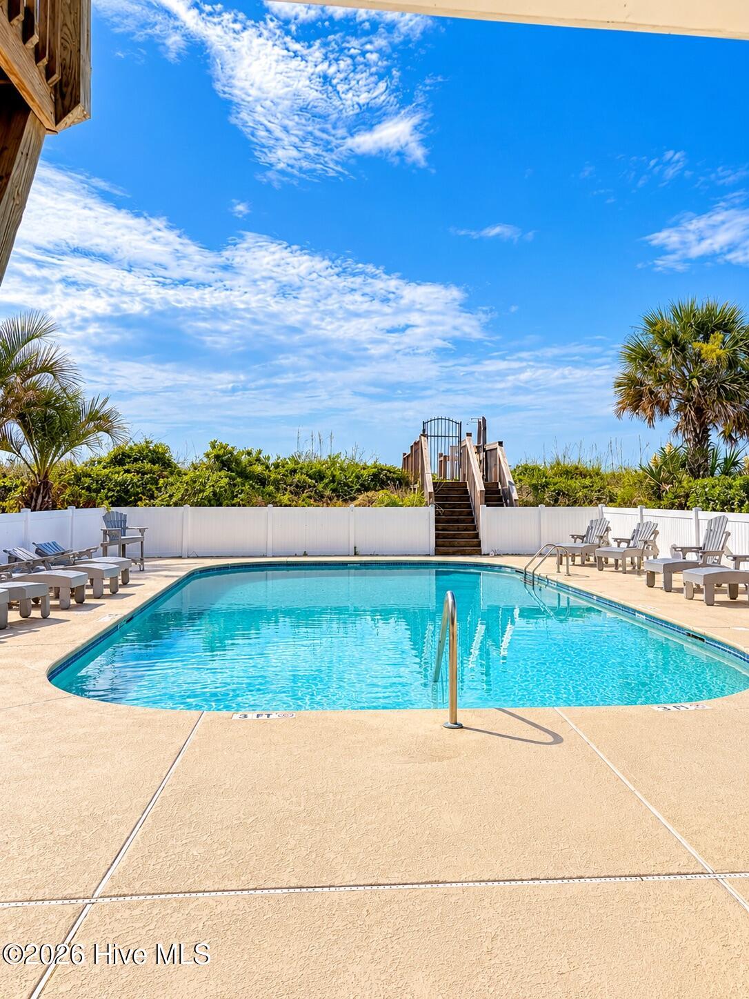 Oceanfront club house and pool with private beach access.