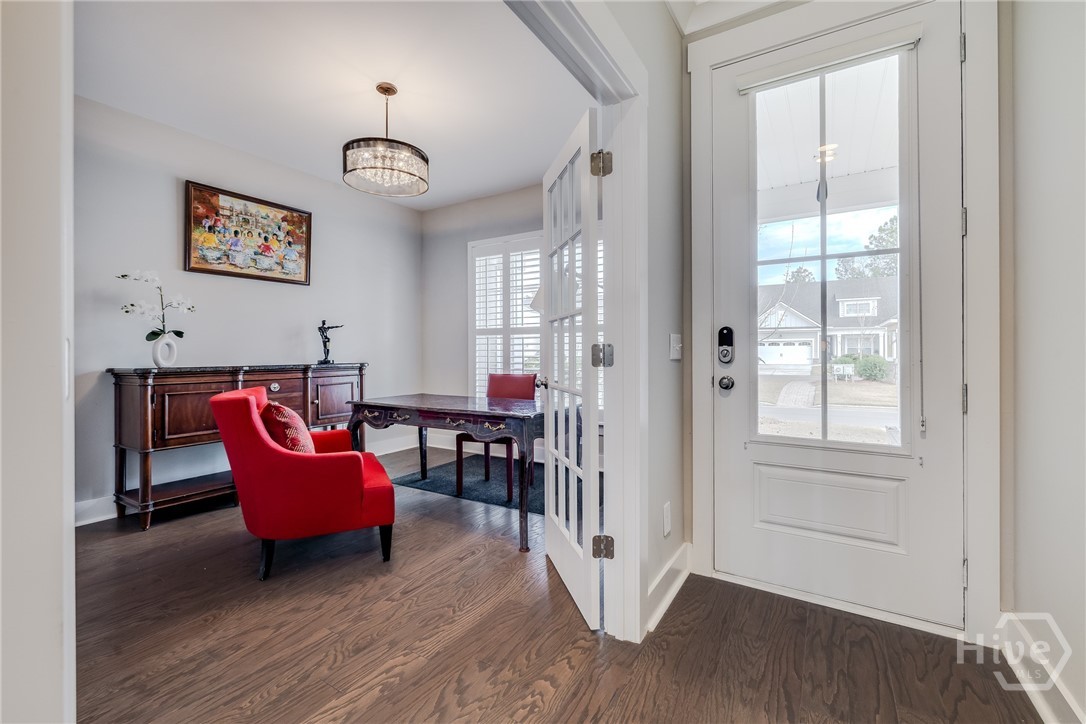 Front Room - 16 pane French Doors, large closet, access to full bath.  Currently used as office but could be bedroom.