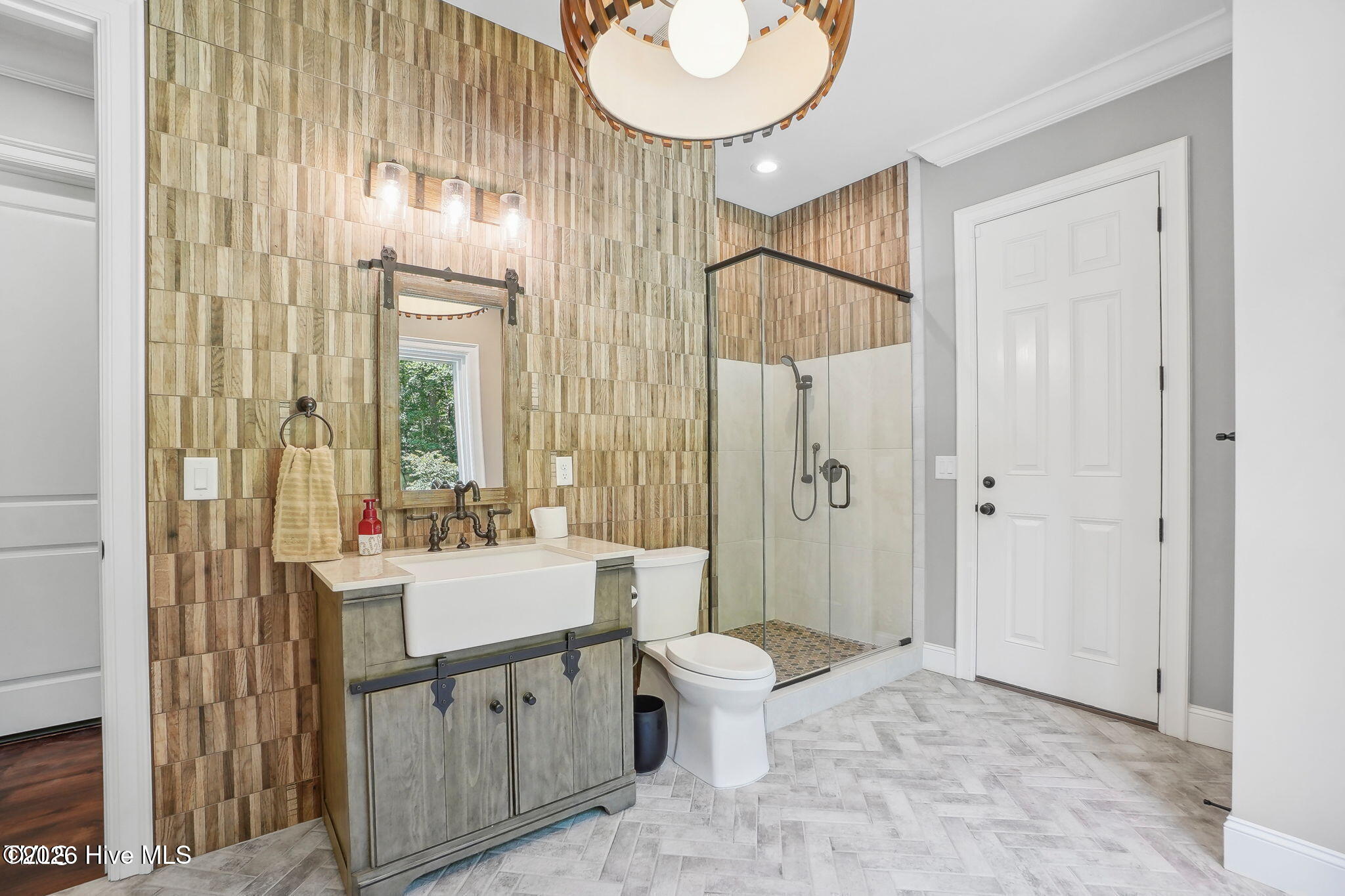 Full bath in basement with walk-in shower.