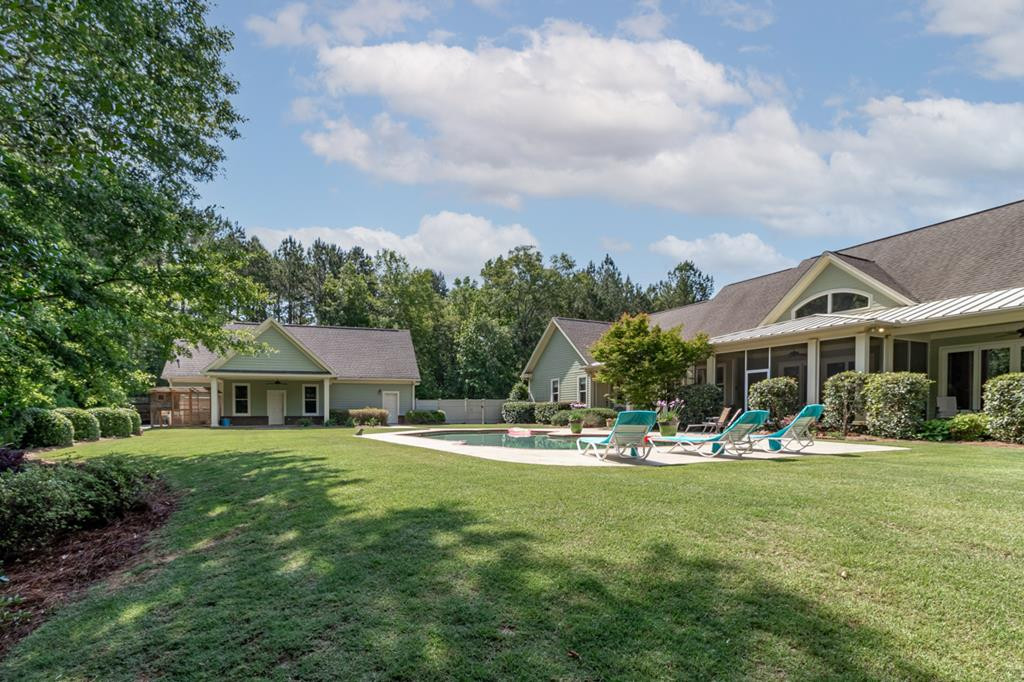 Rear View of Home & Detached Garage