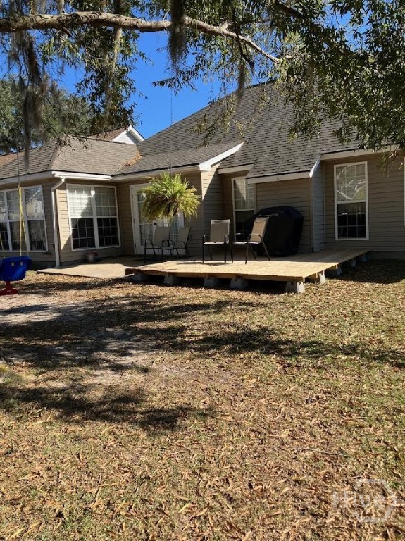 Another view of back yard with decking