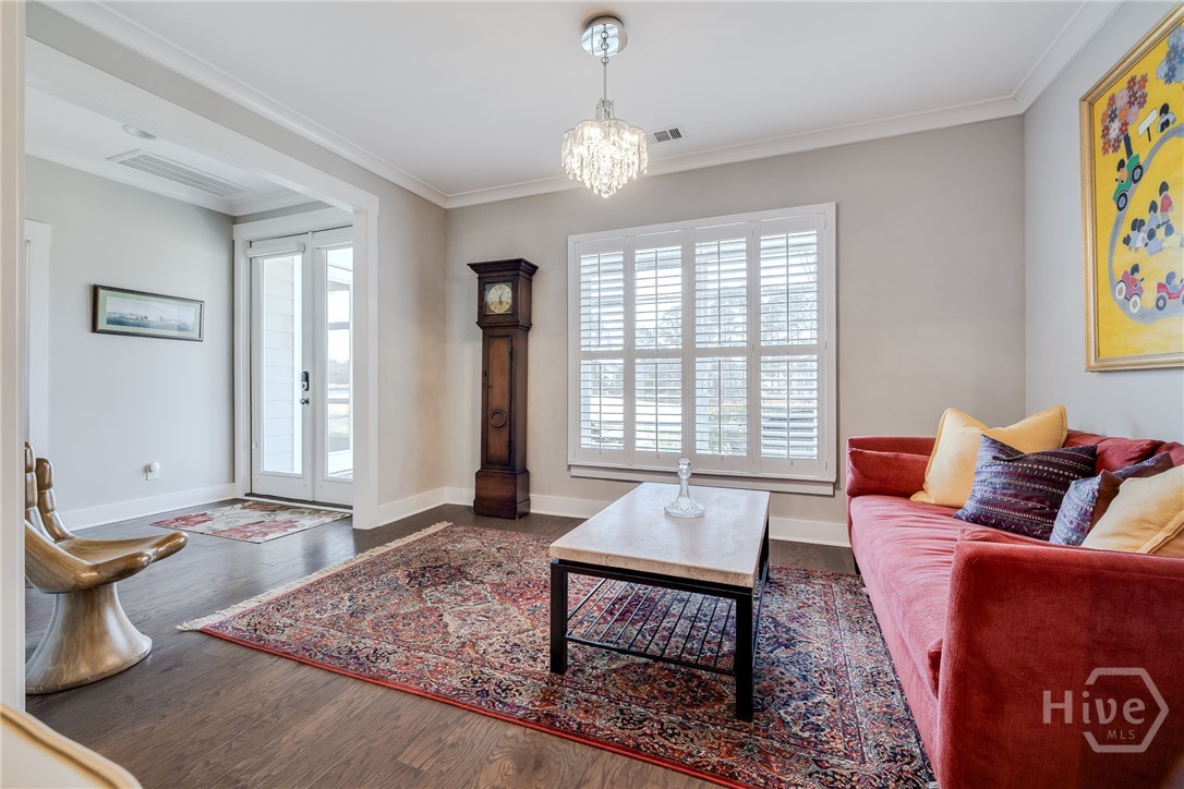 Carolina Room - view of screened porch/golf course and back Foyer