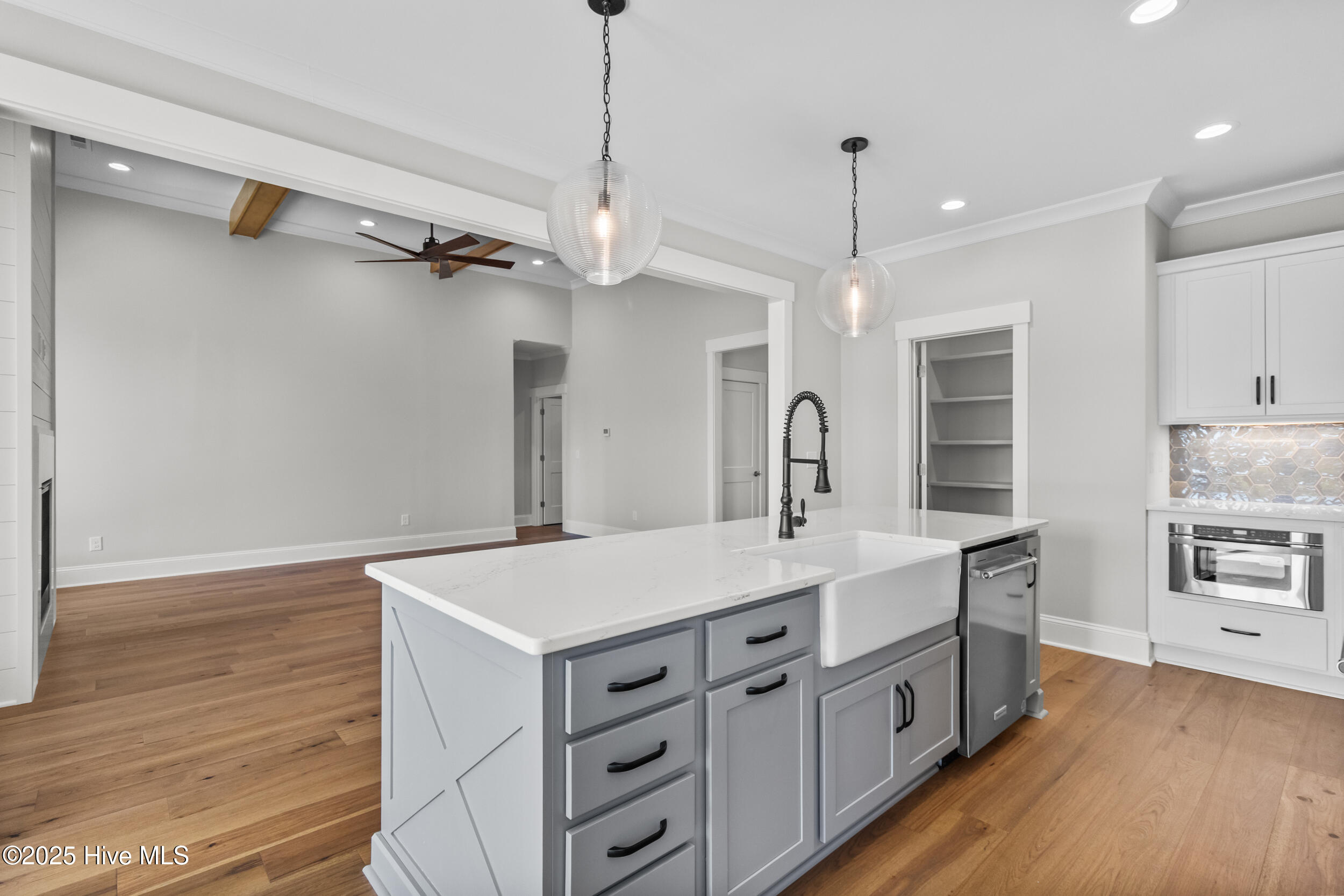 Kitchen opening to living area