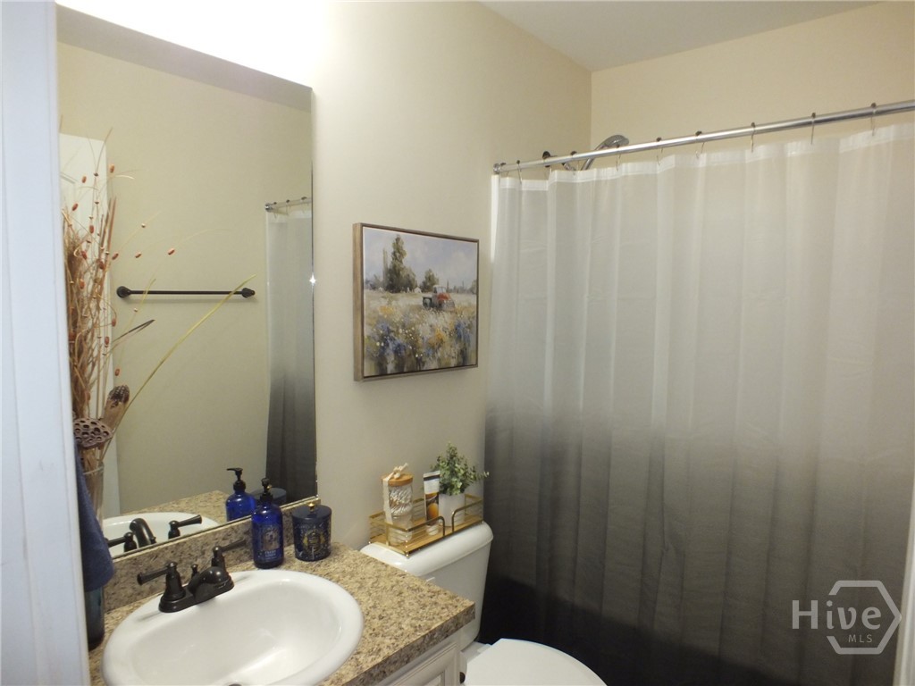 Guest bath with deep tub shower combo.