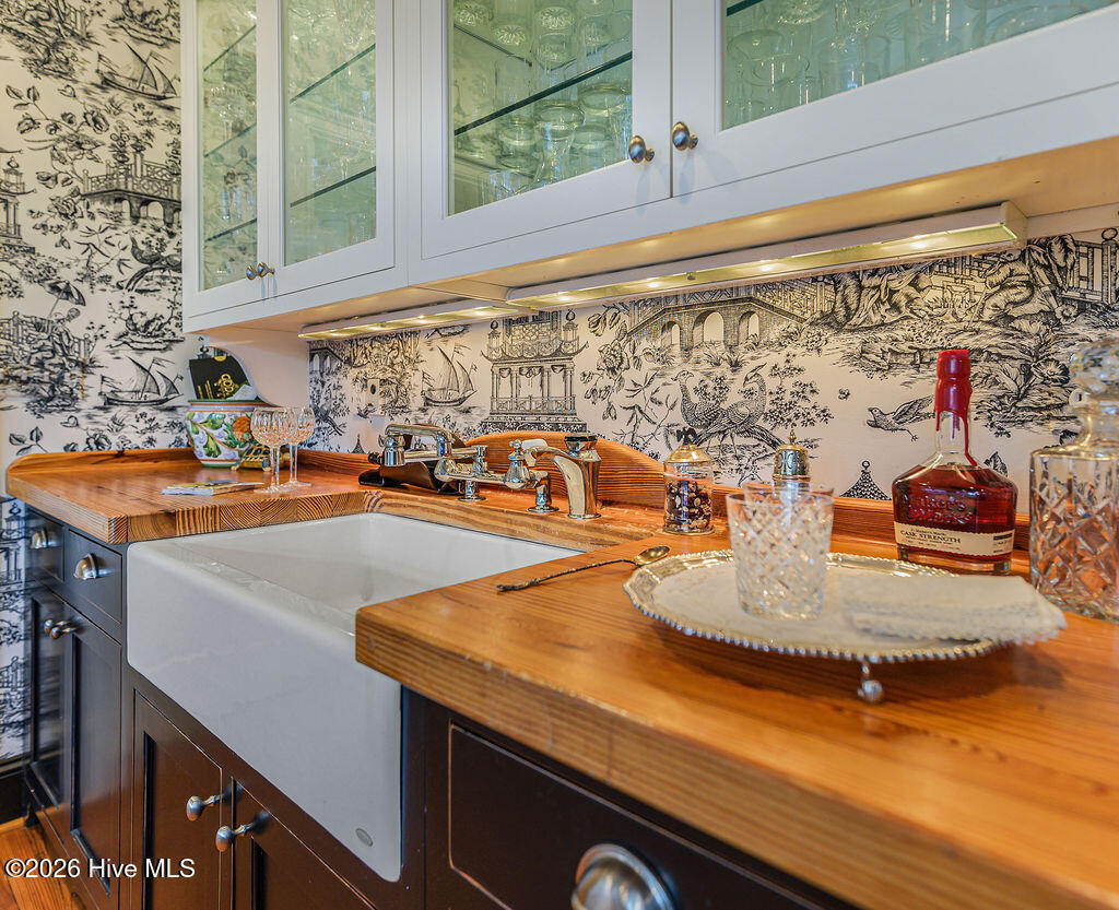 Butler’s pantry with farm sink and butcher block counter