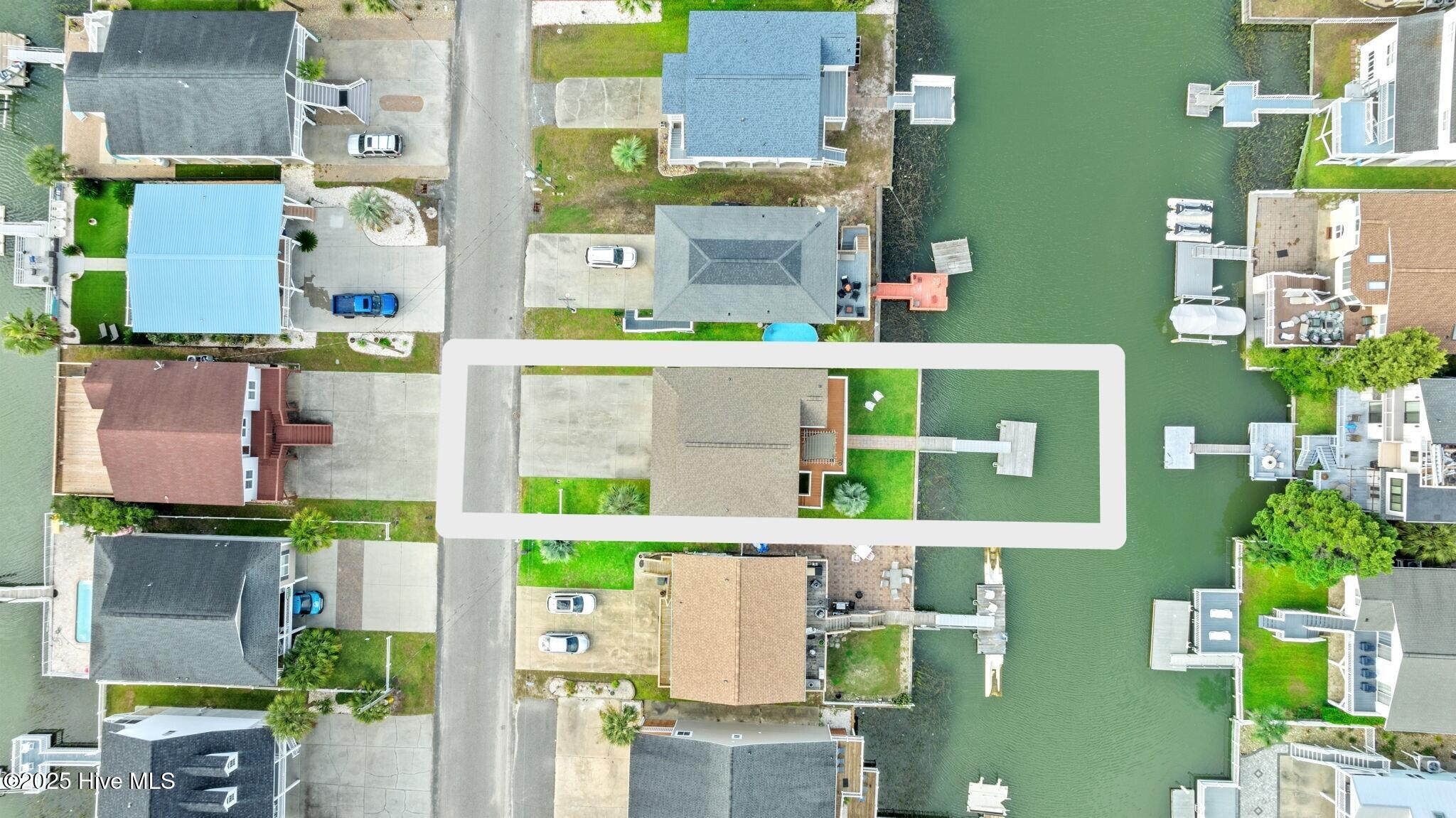 Aerial view of extended backyard.