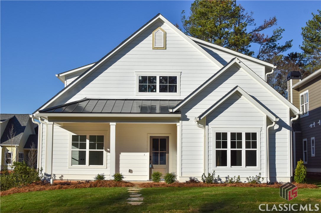 Cottage home located in premier Normaltown neighborhood at Parkside at Normaltown. Low maintenance living in the heart of Athens with an HOA. This plan features 4 bedrooms and 3 baths, open floor plan with living and dining areas flowing into the kitchen, owners suite on the main level, hardwood flooring throughout the main level of the home, gorgeous kitchen with quartz countertops, stainless steel appliances, pantry with barn doors, screened porch and brick patio and 2 car garage with electric car charger already installed.