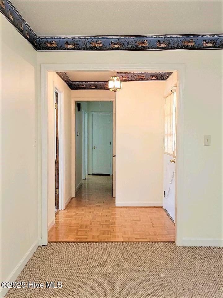 Hall to bedrooms from living